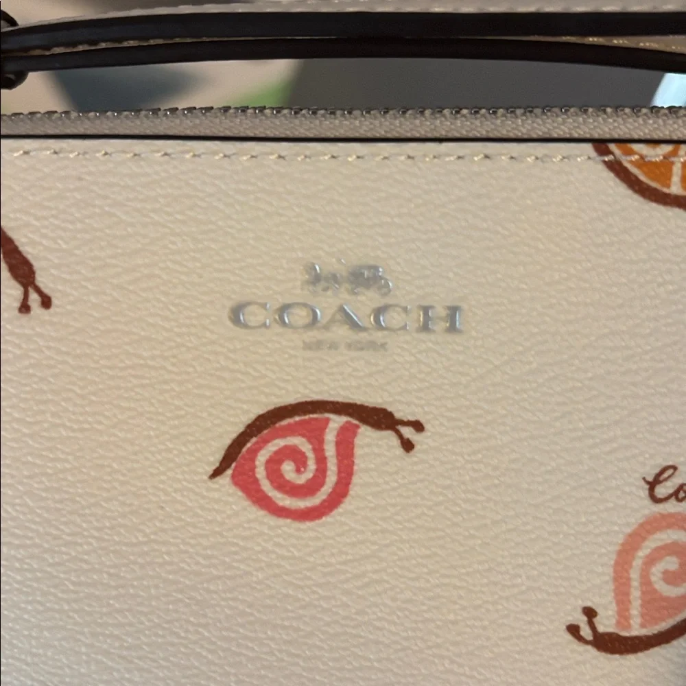 Like New Corner Zip Wristlet in chalk with snail print - Picture 3 of 3